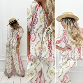 Blouse écrue à motifs roses et verts noeuds